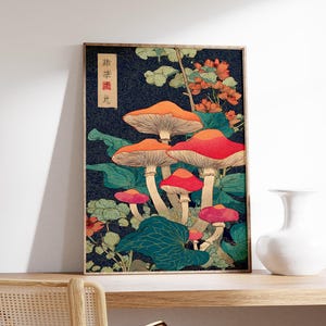 May include: A framed art print with a vintage illustration of mushrooms in red, orange, and pink, set against a dark blue background with green foliage. The artwork has a vintage aesthetic and includes Japanese text.