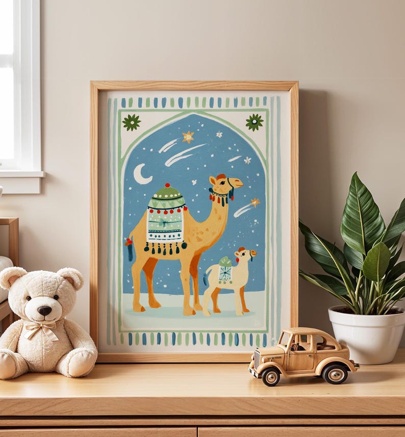 May include: A framed art print featuring a camel and its calf against a blue night sky with stars and a crescent moon. The camel is adorned with decorative saddle blankets. The artwork is in a wooden frame, and the overall theme is a desert scene.
