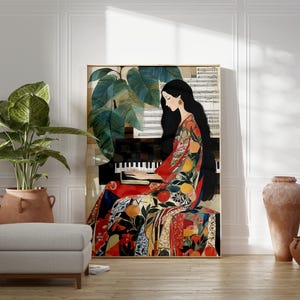 May include: A framed art print shows a woman playing a piano, dressed in a vibrant patterned gown with fruit and foliage motifs. The background features sheet music and large green leaves. The artwork is in a room with a plant and a neutral-toned ottoman.