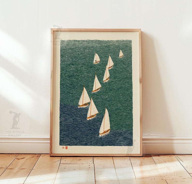 May include: A framed print featuring a fleet of sailboats on a textured ocean. The artwork uses shades of blue and green to depict the water, with white sails catching the wind. The print is in a natural wood frame, creating a nautical theme.