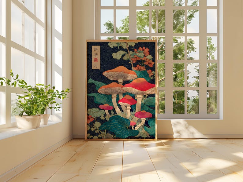 May include: A framed art print depicting stylized mushrooms with red and orange caps against a dark blue backdrop with green leaves. The print includes Japanese text in the upper left corner. The artwork is in a wooden frame.