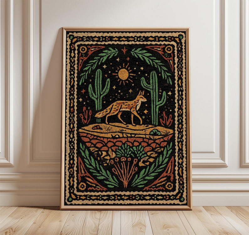 May include: Framed art print featuring a desert landscape with a fox, cacti, and sun. The artwork has a vintage, folk art style with a black background and earth-tone colors. The print is in a wooden frame.