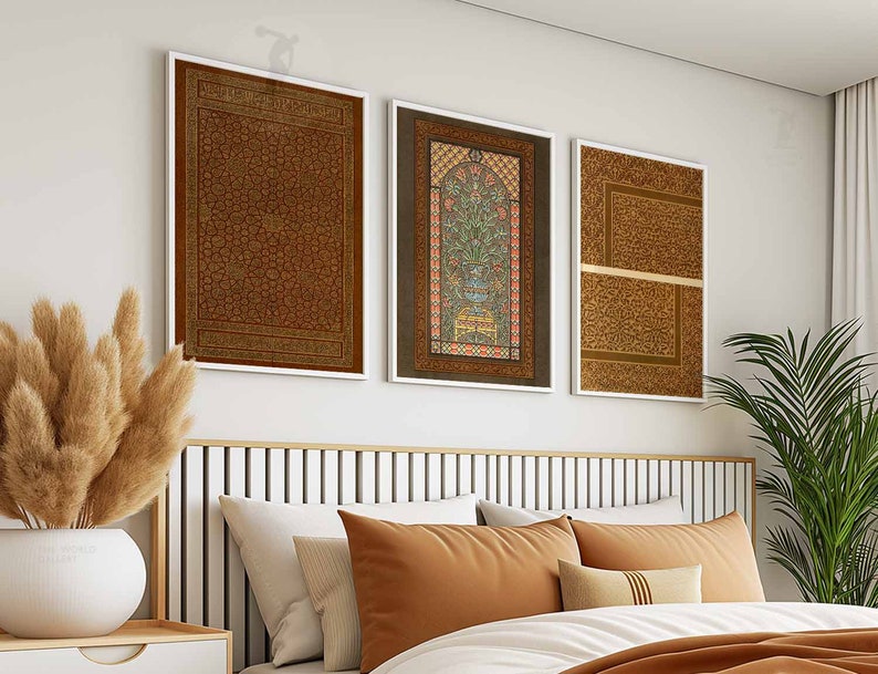 May include: Three framed prints with intricate patterns and designs in shades of brown, gold, and red. The prints are hung on a white wall above a headboard.