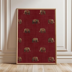 May include: A framed print featuring a repeating pattern of elephants on a deep red background. The elephants are detailed with ornate designs in shades of gold, brown, and red. The artwork is displayed in a wooden frame, adding a touch of warmth to the piece.