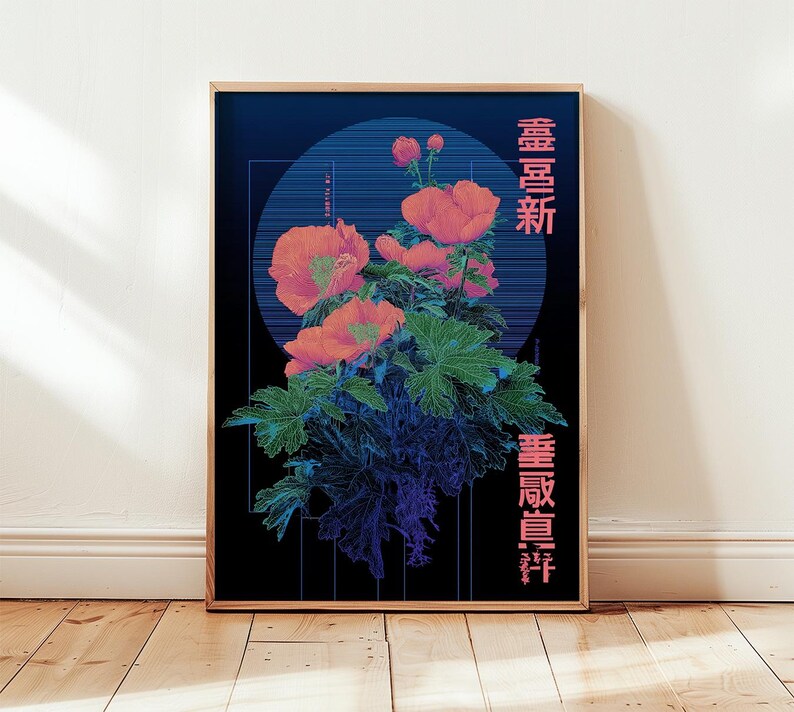 May include: A framed art print featuring a floral design with orange flowers and green leaves against a dark blue background. The artwork includes Japanese text in pink. The print is displayed on a wooden floor.