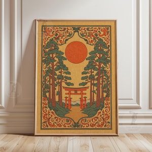 May include: Framed art print featuring a stylized Japanese landscape. The artwork depicts a red torii gate, tall trees, and a setting sun. The color palette includes shades of orange, green, and brown, with decorative floral elements.