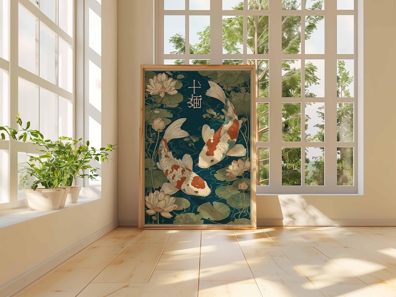 May include: Framed art print featuring two koi fish swimming in a pond with lily pads and lotus flowers. The fish are white with orange and black markings. The background is a dark teal color. Japanese characters are at the top.