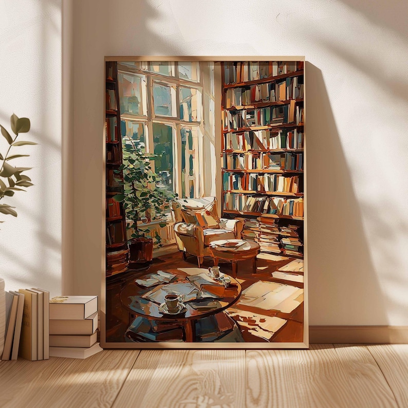 May include: A framed art print depicts a cozy reading nook. The scene includes a large window, a comfortable armchair, a round coffee table, and a towering bookshelf filled with books. Sunlight streams through the window, illuminating the room and creating a warm, inviting atmosphere.