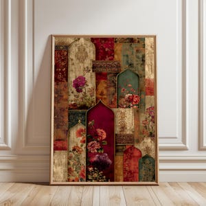 May include: A framed art print featuring a collage of floral patterns and arch shapes in shades of red, gold, and green. The artwork has a vintage, textured appearance, with detailed floral designs and ornate borders. The print is displayed on a wooden floor.