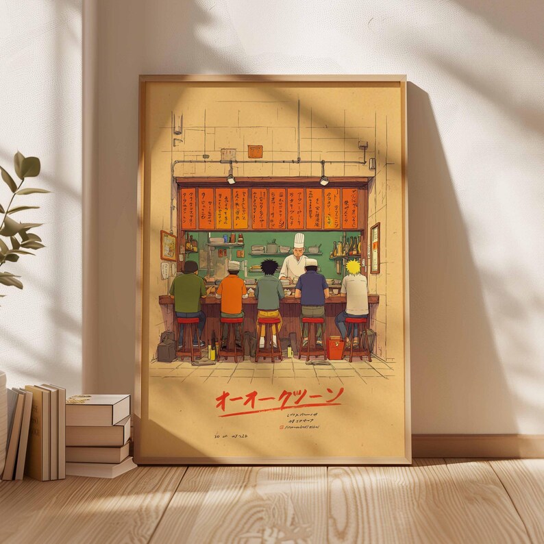 May include: Illustration of a Japanese ramen shop scene. The artwork depicts a chef behind a counter serving customers seated on stools. The shop's name is written in Japanese characters. The color palette includes warm tones of orange, brown, and green.