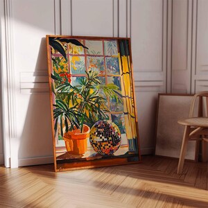 May include: A painting of a window with a potted plant and a disco ball. The window is open and the sun is shining through. The plant is green and the disco ball is silver with mirrored tiles.