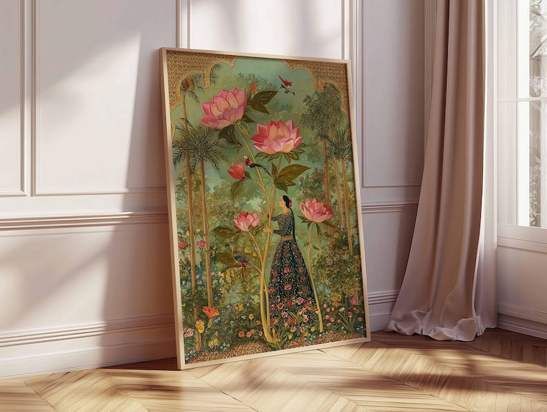 May include: A framed art print featuring a woman in a floral dress amidst a garden scene. The artwork showcases large pink flowers, lush greenery, and birds. The frame is a light wood color, and the overall aesthetic is reminiscent of vintage botanical illustrations.