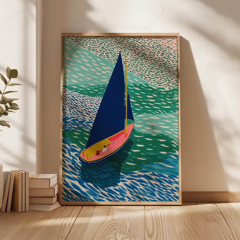 May include: A framed art print depicting a sailboat on the water. The boat has a blue sail and a pink and yellow hull. The water is shown in shades of blue and green, with a textured look. The artwork is in a wooden frame.