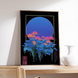 May include: Framed art print featuring a stylized floral design with a blue gradient circle on a black background. The flowers are pink and orange, with blue foliage. Japanese characters are in the lower left corner. The print is displayed on a wooden shelf.