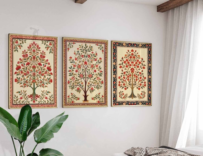 May include: Three framed prints of stylized floral trees with red flowers and green leaves. The frames are gold, black, and white.