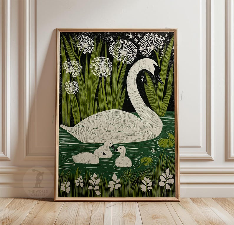 May include: A framed art print featuring a swan and two cygnets swimming in a pond. The artwork has a vintage style with a white swan, green reeds, and white flowers against a dark background. The World Gallery logo is in the bottom left corner.