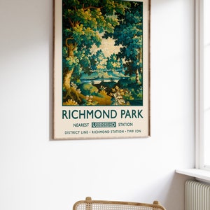 May include: A vintage-style poster advertising Richmond Park in London. The poster features a green and brown tapestry-like image of a forest scene. The text on the poster reads "Richmond Park" and "Nearest Underground Station District Line - Richmond Station - TW9 1DN."