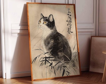 May include: A vintage Japanese art print featuring a black and white cat sitting in a field of bamboo. The print has the Japanese characters "猫が歩く" which translates to "Cat walking".