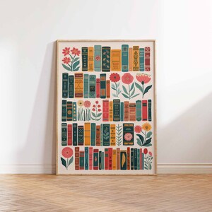 May include: A framed print featuring a colorful illustration of a bookshelf filled with books and flowers. The books are arranged in rows and have different colors and patterns. The flowers are in various shades of pink, red, and yellow.