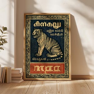 May include: A framed vintage-style poster featuring a detailed illustration of a tiger. The tiger is depicted in a seated position with a golden-yellow and black striped pattern against a dark blue background. The poster includes text in a foreign language.