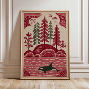 May include: Framed art print featuring a stylized landscape with a red and green forest, a red and white ocean, and a black orca. The artwork has a vintage aesthetic, with a beige background and a wooden frame.