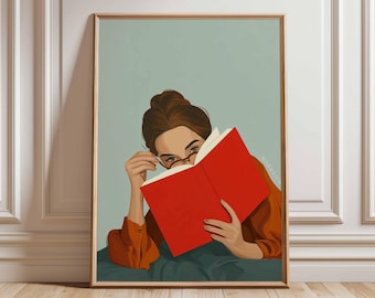 May include: Illustration of a person reading a book, wearing glasses, and an orange shirt. The book is bright red, and the background is a light teal color. The artwork is framed in a wooden frame and is leaning against a white wall.
