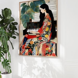 May include: A framed art print showing a woman playing a piano. She is dressed in a colourful patterned gown with fruit motifs. The artwork includes a piano, sheet music, and large green leaves. The frame is a light brown colour.