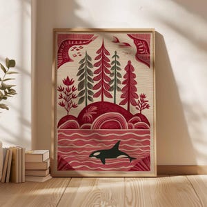May include: A framed art print featuring a stylized landscape with a red and green color palette. The artwork depicts trees, rolling hills, and an orca whale in the water. The print has a natural, textured background.