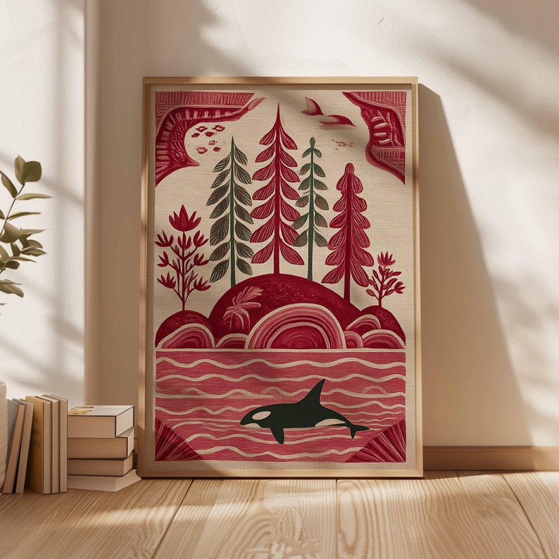 May include: A framed art print featuring a stylized landscape with a red and green color palette. The artwork depicts trees, rolling hills, and an orca whale in the water. The print has a natural, textured background.