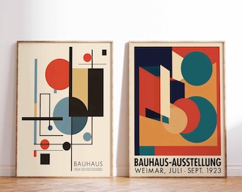 May include: Two framed prints with geometric abstract designs in red, yellow, blue, and black. The left print has the text "Bauhaus 1924" and the right print has the text "Bauhaus-Ausstellung Weimar, Juli-Sept. 1923".