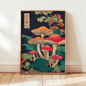May include: A framed art print depicting a vibrant illustration of mushrooms. The mushrooms have orange and red caps with white stems, set against a dark blue backdrop with green foliage and orange flowers. The print includes Japanese text in the upper left corner.
