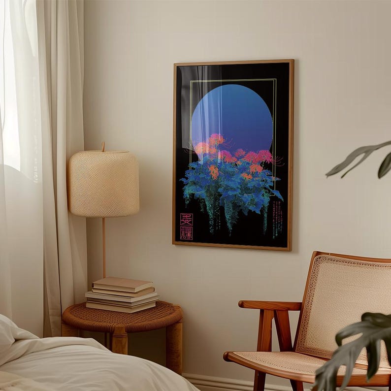 May include: Framed art print featuring a stylized floral design with a large blue circle against a black background. The artwork includes orange and pink flowers with blue foliage, set within a wooden frame. The print has Japanese text in the lower corners.