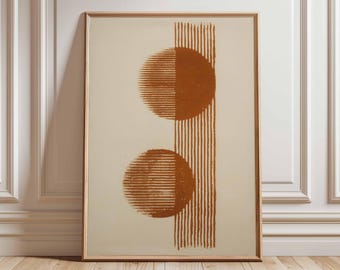 May include: Framed abstract art print featuring two rust-colored, semi-circular shapes and vertical lines on a cream background. The artwork is encased in a light brown wooden frame, suitable for home decor.