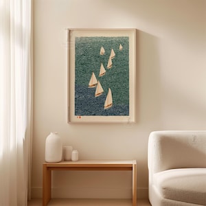 May include: A framed art print depicting sailboats on a textured teal and navy blue sea. The sailboats have white sails and are arranged in a diagonal pattern. The print is in a light wood frame.