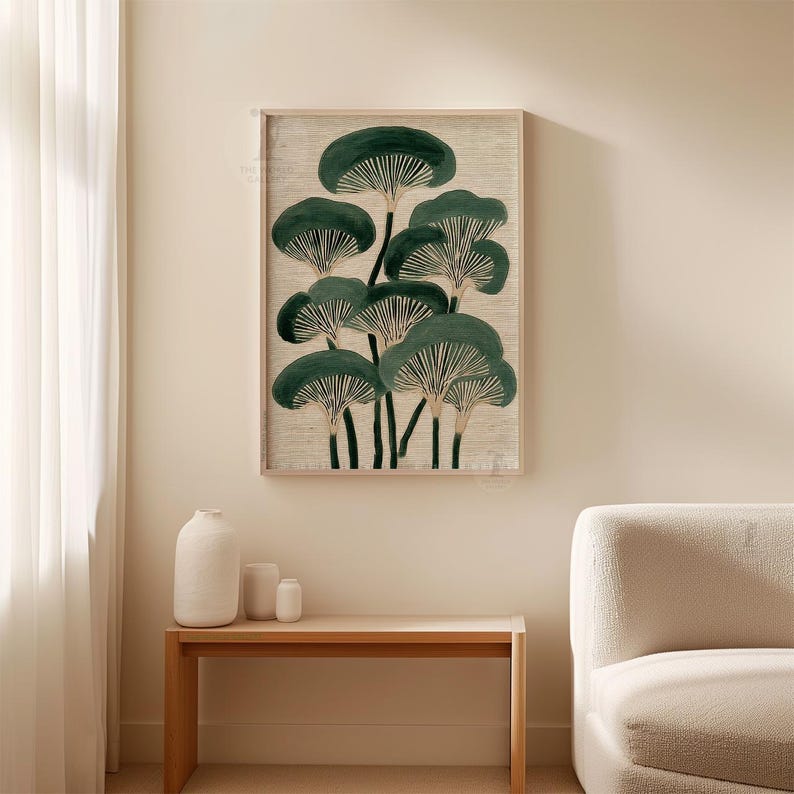 May include: A framed botanical print featuring a cluster of stylized, dark green mushroom-like forms against a neutral background. The artwork is displayed in a light-colored wooden frame, adding a touch of natural elegance to the wall decor. The print is a decorative piece.