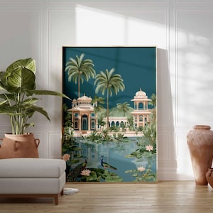 May include: A framed art print depicting an Indian palace scene with palm trees, peacocks, and water lilies. The artwork features a teal background and is displayed in a room with a large potted plant, a gray ottoman, and decorative pottery.