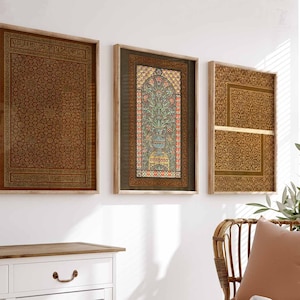 May include: Three framed prints with intricate patterns and designs. The center print features a colorful floral motif with a vase and a bird. The prints are in a modern style and would look great in a living room or bedroom.