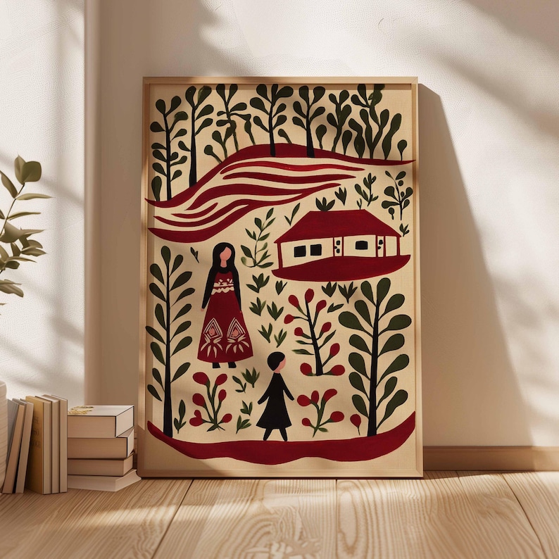 Op de afbeelding: Een ingelijste kunstdruk met een illustratie in folk art-stijl. Het kunstwerk toont een huis met een rood dak, twee figuren en gestileerde bomen en bladeren in rood, groen en zwart tegen een beige achtergrond.