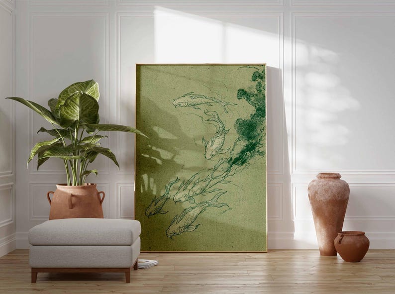 May include: A framed art print featuring a green and white illustration of koi fish swimming. The artwork is displayed in a room with a plant, ottoman, and decorative vases. The print has a gold frame.