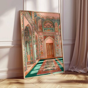 May include: A framed art print depicting an ornate interior scene. The artwork features a detailed rendering of a room with archways, floral patterns, and a patterned rug. The color palette includes pink, teal, and gold tones, creating a sense of historical elegance.