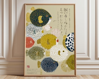 May include: A framed art print featuring a collection of stylized pufferfish in various colors, including navy, yellow, white, and red, against a beige background. The artwork has Japanese text and a red seal.