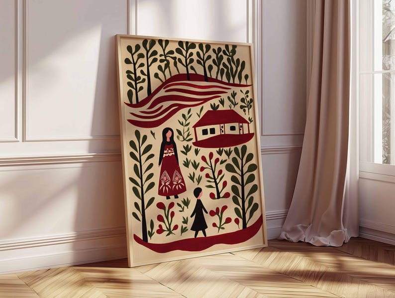 Op de afbeelding: Een ingelijste kunstdruk met een landschap in folk-art-stijl met een rood huis, figuren en gestileerde bomen. Het kunstwerk heeft een cr&egrave;mekleurige achtergrond met rode, zwarte en groene elementen. Het frame is licht van kleur.