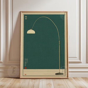 May include: A framed art print with a minimalist illustration of a gold arc floor lamp and cream lampshade against a dark teal background. The print includes Japanese text and a red seal. The frame is a light brown color.