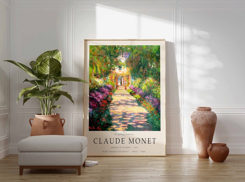 May include: A framed poster featuring a painting by Claude Monet titled "Garden at Giverny". The painting depicts a path lined with flowers leading to a house in the distance. The poster includes the artist's name, the title of the painting, and the year it was created.