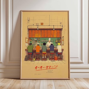 May include: Framed art print depicting a Japanese ramen shop scene. The illustration shows a chef behind a counter serving customers seated at a bar. The print has a vintage aesthetic with Japanese text at the bottom.