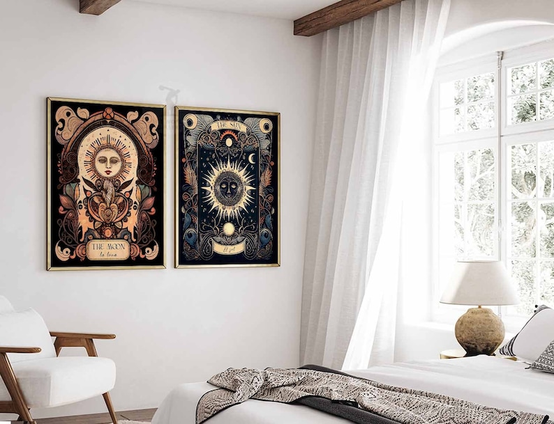 May include: Two framed prints with gold frames, one depicting the sun and the other the moon. The sun print has the text "THE SUN" and the moon print has the text "THE MOON". Both prints have a dark background with intricate details in gold, red, and blue.