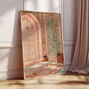 May include: A framed print showing an ornate interior scene. The artwork features a detailed archway, floral patterns, and a colourful rug. The colour palette includes soft pinks, greens, and golds, creating a serene and artistic ambience.