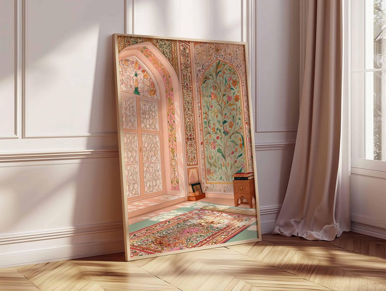 May include: A framed print showing an ornate interior scene. The artwork features a detailed archway, floral patterns, and a colourful rug. The colour palette includes soft pinks, greens, and golds, creating a serene and artistic ambience.