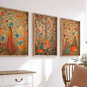 May include: Three framed prints with intricate floral patterns and figures in traditional Indian clothing. The prints are set against a white wall and feature a variety of colors, including red, blue, green, and gold.