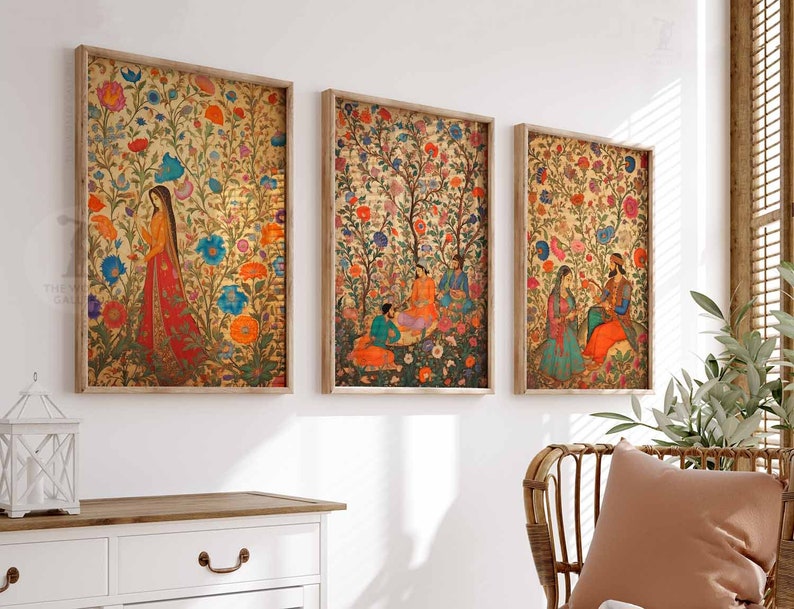 May include: Three framed prints with intricate floral patterns and figures in traditional Indian clothing. The prints are set against a white wall and feature a variety of colors, including red, blue, green, and gold.